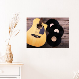 Plakat samoprzylepny Gitara i winylowe płyty na drewnianym stole