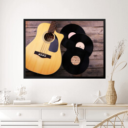 Obraz w ramie Gitara i winylowe płyty na drewnianym stole