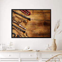 Obraz w ramie Instrumenty muzyczne na drewnianym, niejednolitym tle
