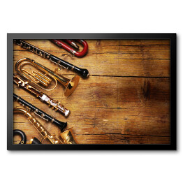 Obraz w ramie Instrumenty muzyczne na drewnianym, niejednolitym tle