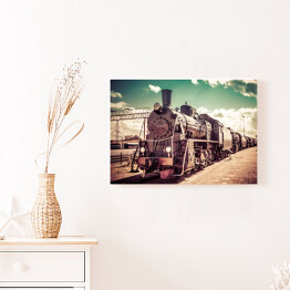 Obraz na płótnie Stara parowa lokomotywa na tle pastelowego nieba