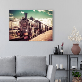 Obraz na płótnie Stara parowa lokomotywa na tle pastelowego nieba