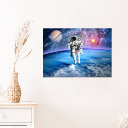 Plakat Astronauta oraz Saturn we Wszechświecie