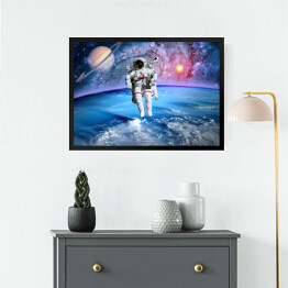 Obraz w ramie Astronauta oraz Saturn we Wszechświecie