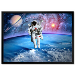 Plakat w ramie Astronauta oraz Saturn we Wszechświecie