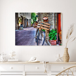 Obraz na płótnie Stary rower z drewnianą skrzynią przy ścianie z cegły w San Gimignano