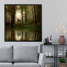 Obraz w ramie Jeleń nad rzeką w lesie