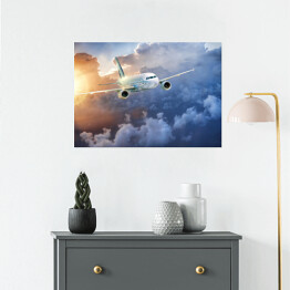 Plakat Samolot wśród chmur w blasku słońca