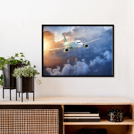 Plakat w ramie Samolot wśród chmur w blasku słońca