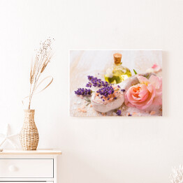 Obraz na płótnie Olejek z lawendą i kwiatem róży