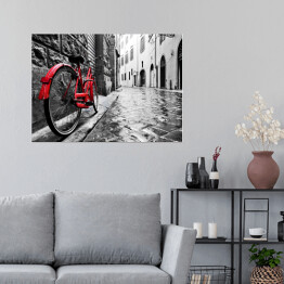 Plakat Retro czerwony rower na chodniku w starym miasteczku
