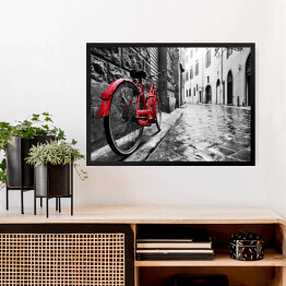 Obraz w ramie Retro czerwony rower na chodniku w starym miasteczku