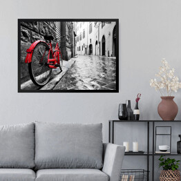 Obraz w ramie Retro czerwony rower na chodniku w starym miasteczku