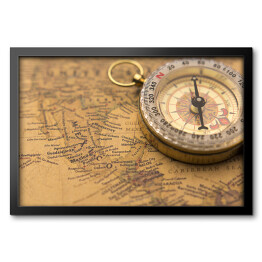 Obraz w ramie Stary kompas na vintage mapie