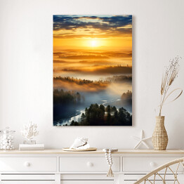 Obraz na płótnie Pejzaż zachód słońca nad lasem we mgle