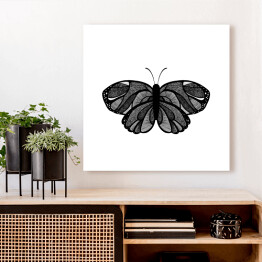 Obraz na płótnie Czarny motyl z szarymi elementami na białym tle