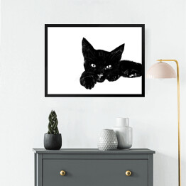 Obraz w ramie Leżący czarny kociak z wyciągniętą łapką