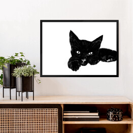 Obraz w ramie Leżący czarny kociak z wyciągniętą łapką