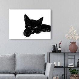Obraz na płótnie Leżący czarny kociak z wyciągniętą łapką